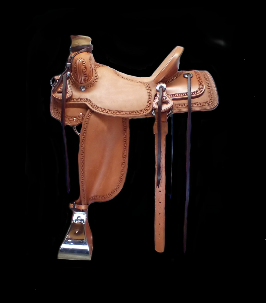 16 Economy style saddle with smooth finish and barbed wire tooled border  and is accented with engraved silver conchos